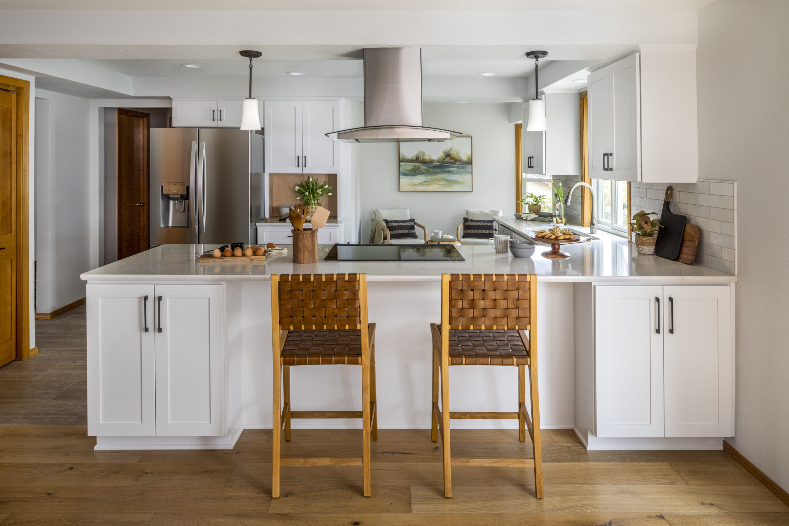 At the Kurth Street Kitchen Remodel, we kept the existing layout, but removed the upper cabinets over the peninsula to open up the spaces. What a difference!